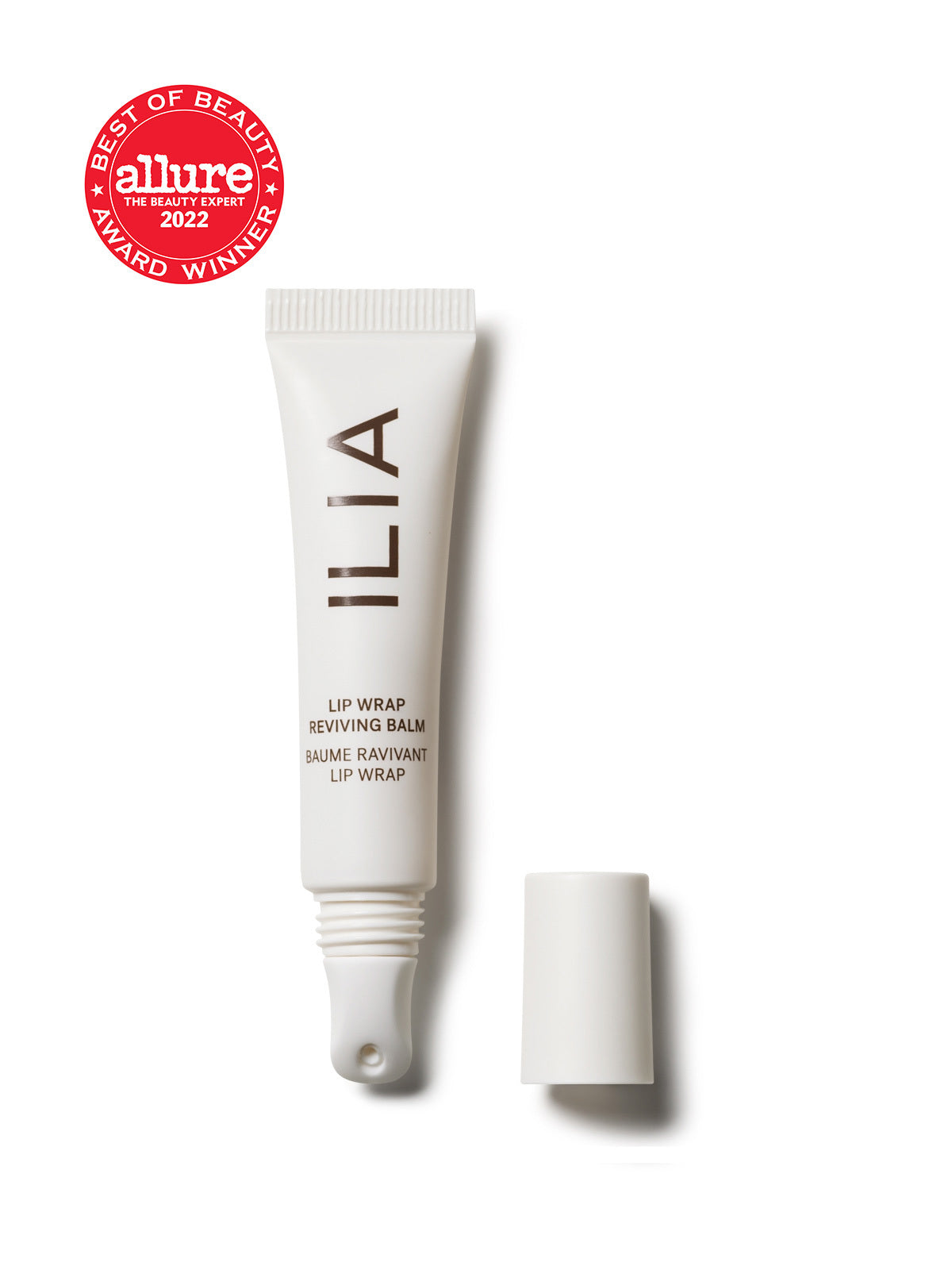 A close-up of the ILIA Lip Wrap Reviving Balm, showing its sleek white tube packaging.