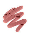 A textured swatch of ILIA lip liner in a beige pink shade, showcasing its smooth and creamy formula.