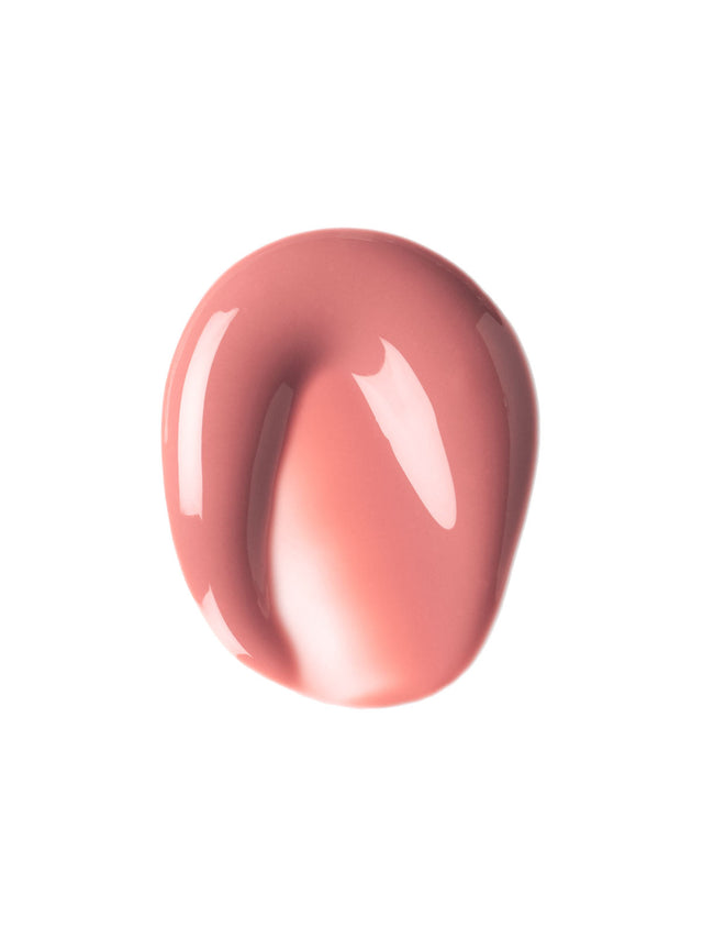 Close-up of a glossy nude, rose-colored liquid lipstick swatch with smooth texture.