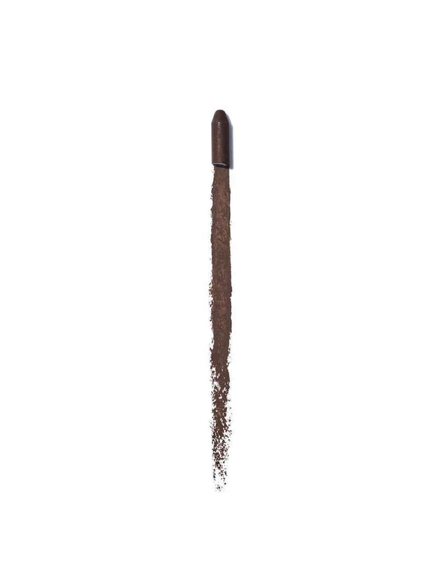 Smudged dark brown eyeliner stroke with a rounded tip at the top.