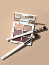 Two ILIA brushes and the Necessary Eyeshadow Palette on a tan background.