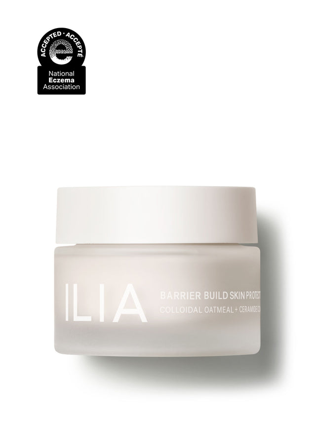 A jar of ILIA Barrier Build Skin Protectant with colloidal oatmeal and ceramides, featuring the National Eczema Association seal.