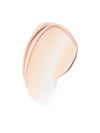 A smooth beige swatch of ILIA eye cream product.