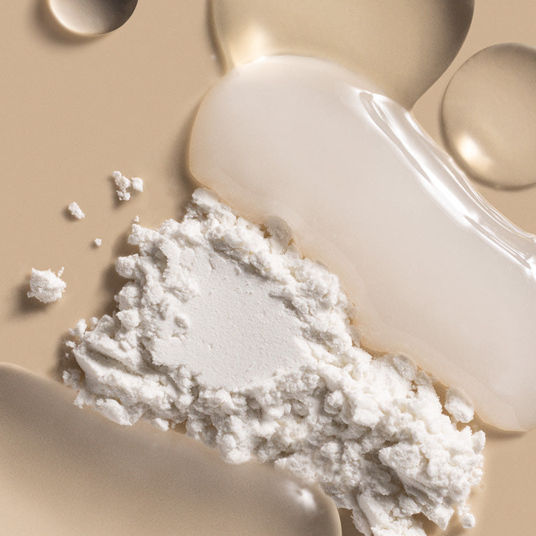 ILIA's Super Serum Skin Tint SPF 40 key ingredients swatched amongst one another on a tan background.