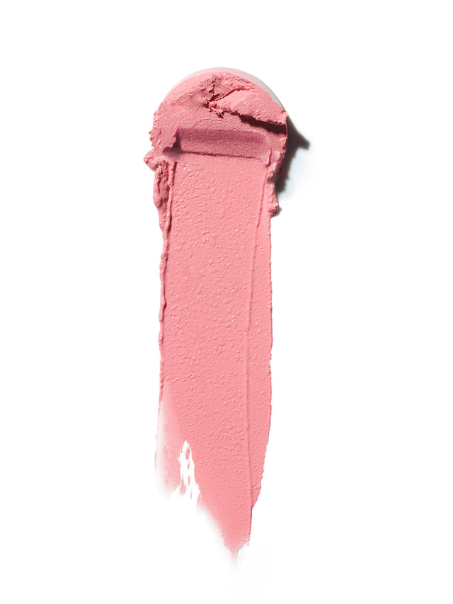 Swatch of a creamy pink multi-stick, featuring a smooth texture with visible pigment and a slight sheen.