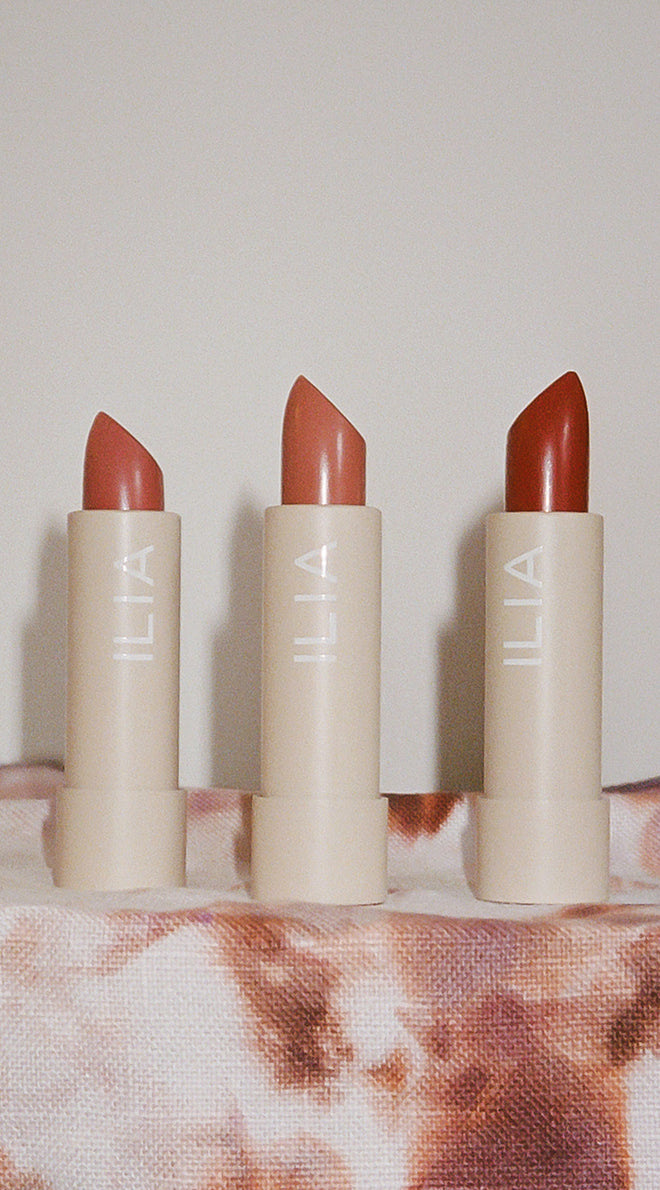 Three ILIA lipsticks with a neutral background to support gift with purchase over $75.