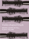 Violin-shaped brush with black bristles on a purple background