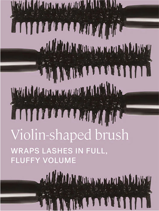 Violin-shaped brush with black bristles on a purple background